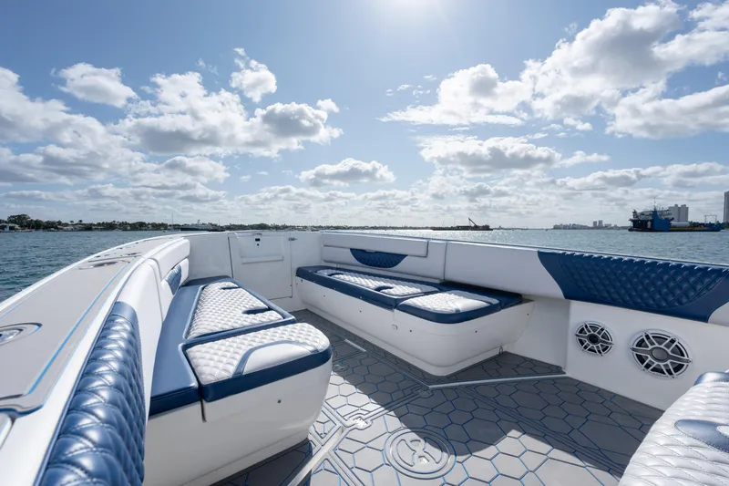 Slide: The Image of 2007 Intrepid 375 Center Console boat with blue and white seating, on a sunny day. - 10