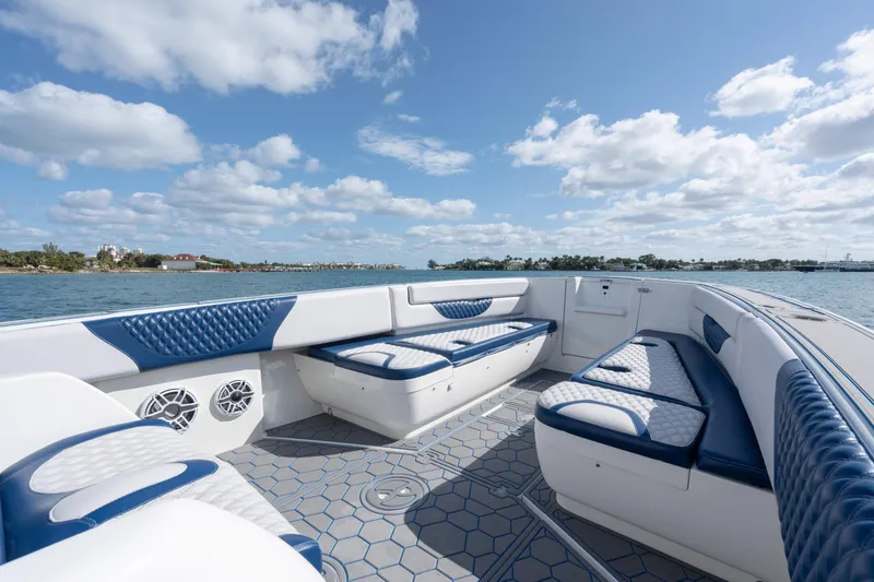 Slide: The Image of 2007 Intrepid 375 Center Console boat with blue and white seating, on a sunny day. - 11