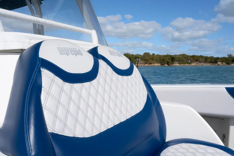 Slide: The Image of 2007 Intrepid 375 Center Console boat seat with blue and white upholstery, ocean view. - 12