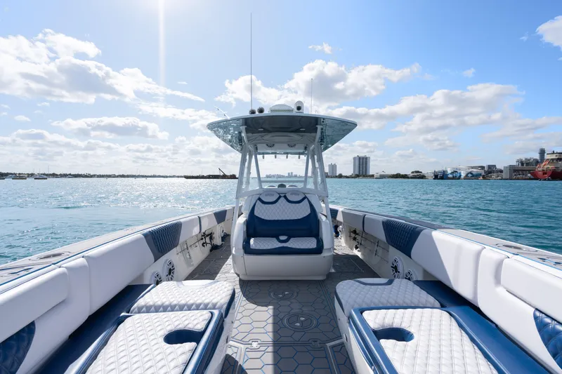 Slide: The Image of 2007 Intrepid 375 Center Console boat on open water under a sunny sky. - 14