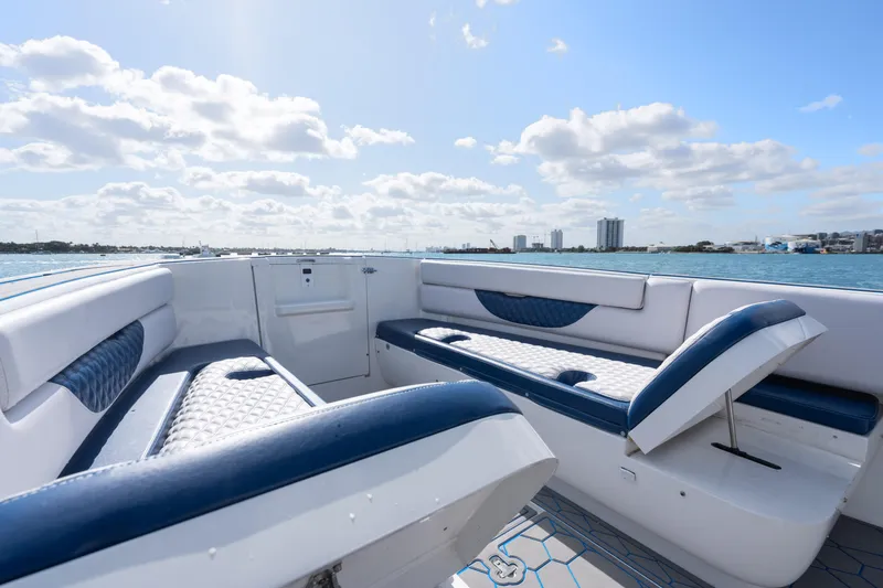 Slide: The Image of 2007 Intrepid 375 Center Console boat interior with blue and white seating, ocean view. - 15