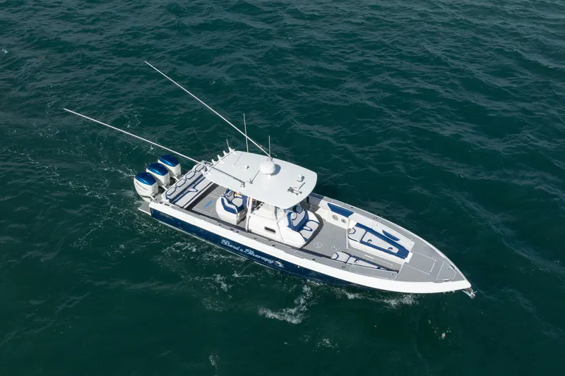 Slide: The Image of 2007 Intrepid 375 Center Console boat cruising on open water. - 2