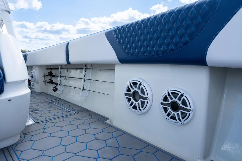 Slide: The Image of 2007 Intrepid 375 Center Console boat interior with rod holders and speakers. - 25