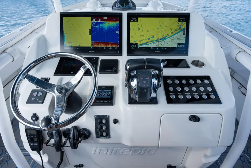 Slide: The Image of 2007 Intrepid 375 Center Console helm with dual navigation screens and controls. - 26