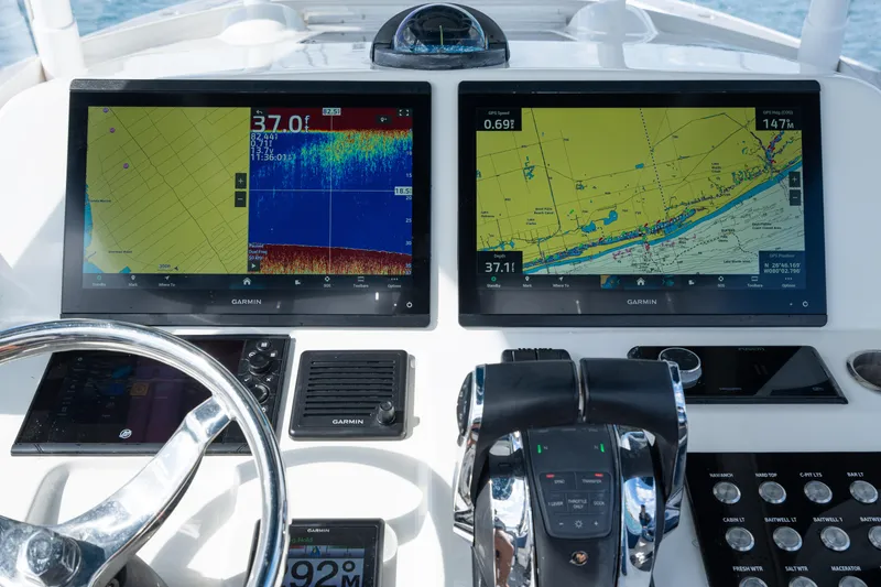 Slide: The Image of Dashboard of a 2007 Intrepid 375 Center Console with navigation screens and controls. - 27