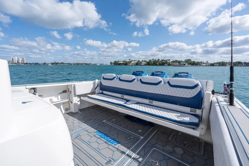 Slide: The Image of 2007 Intrepid 375 Center Console boat with blue seating, on a sunny day at sea. - 31