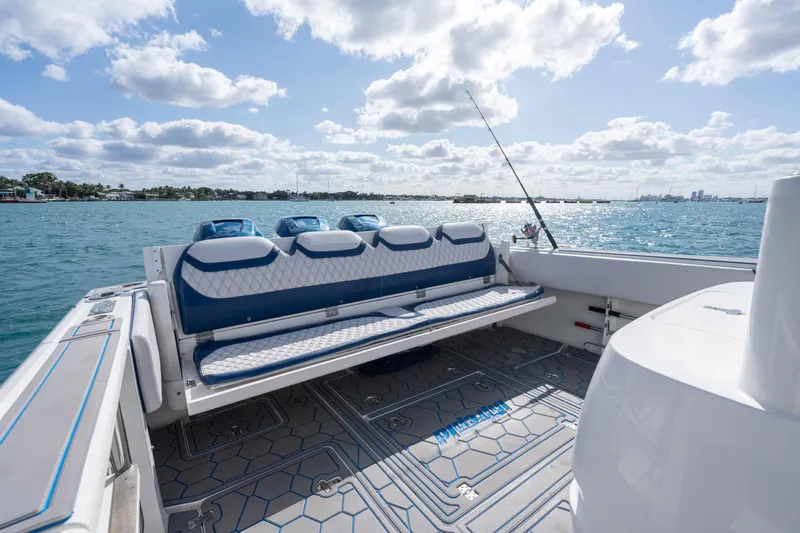 Slide: The Image of 2007 Intrepid 375 Center Console boat with seating, ocean view, and fishing rod. - 32