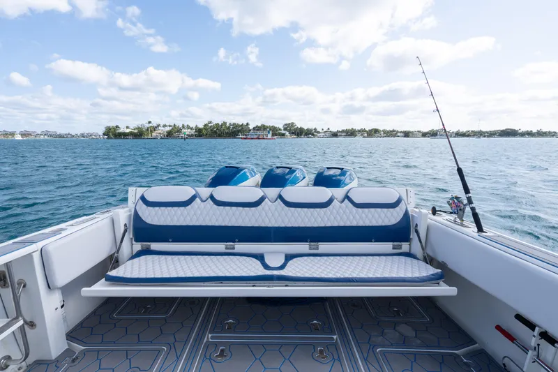 Slide: The Image of 2007 Intrepid 375 Center Console boat with triple engines on open water. - 34