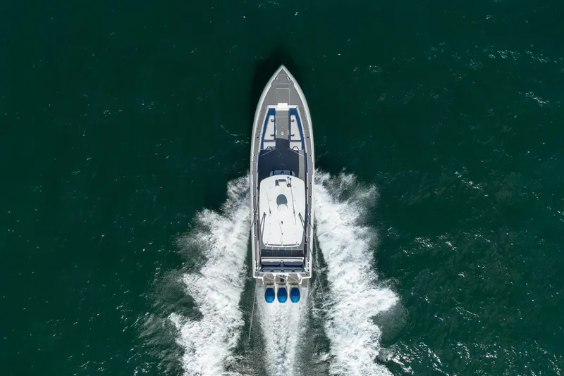 Slide: The Image of Aerial view of 2007 Intrepid 375 Center Console boat cruising on water. - 5