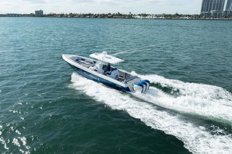 Slide: The Image of 2007 Intrepid 375 Center Console boat cruising on open water. - 8