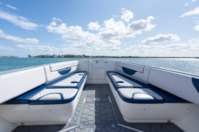 Slide: The Image of 2007 Intrepid 375 Center Console boat interior with cushioned seating, ocean view, and blue sky. - 9