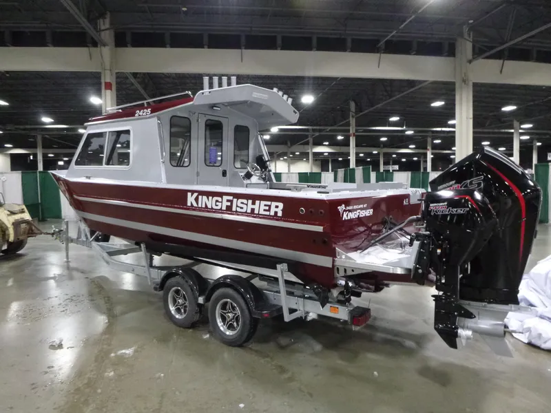 Slide: The Image of 2025 KingFisher 2425 Escape HT boat on trailer in indoor showroom. - 1