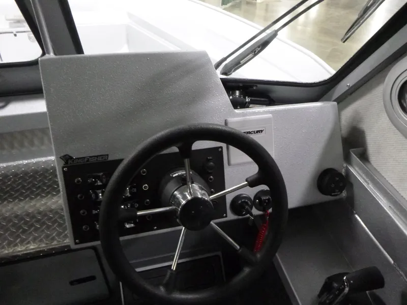 Slide: The Image of Interior view of 2025 KingFisher 2425 Escape HT boat's steering console. - 11