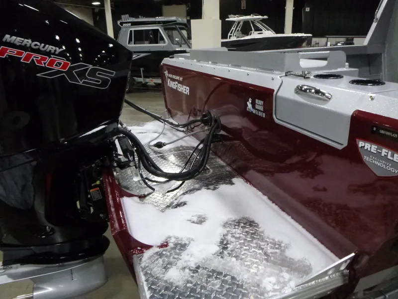 Slide: The Image of 2025 KingFisher 2425 Escape HT boat with Mercury Pro XS engine, showcased indoors. - 23