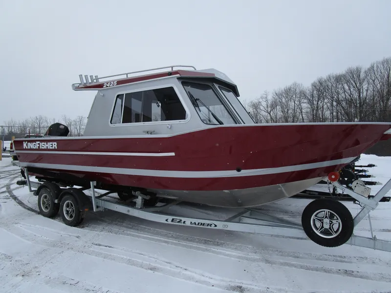 Slide: The Image of 2025 KingFisher 2425 Escape HT boat on trailer, snowy background. - 27