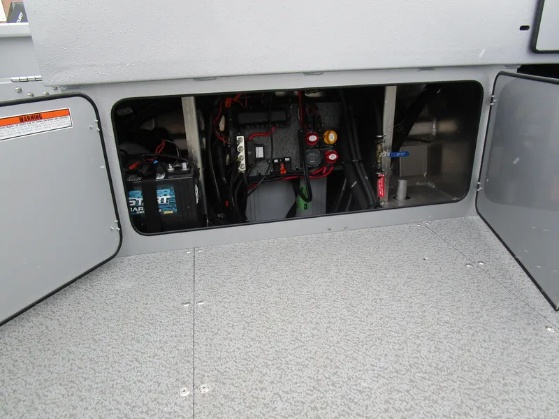 Slide: The Image of 2025 KingFisher 2425 Escape HT boat interior wiring and battery compartment. - 33