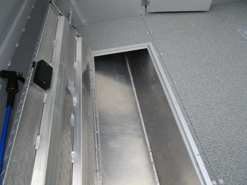 Slide: The Image of Storage compartment in 2025 KingFisher 2425 Escape HT boat, featuring aluminum interior. - 36