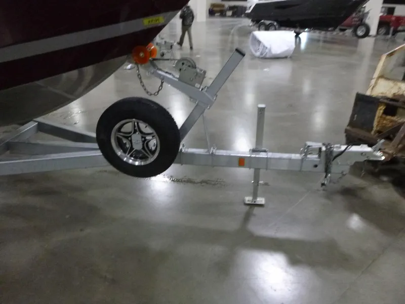 Slide: The Image of Trailer hitch of 2025 KingFisher 2425 Escape HT boat in a showroom. - 4