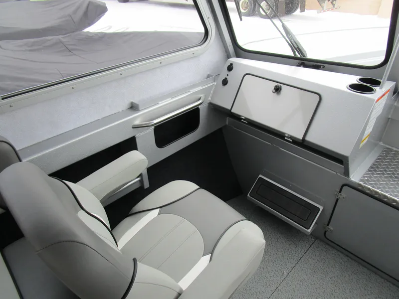 Slide: The Image of Interior of 2025 KingFisher 2425 Escape HT boat, featuring seating and dashboard. - 43