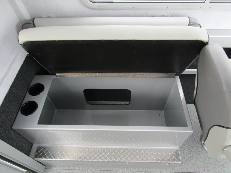 Slide: The Image of Open storage compartment in 2025 KingFisher 2425 Escape HT boat with cup holders. - 44