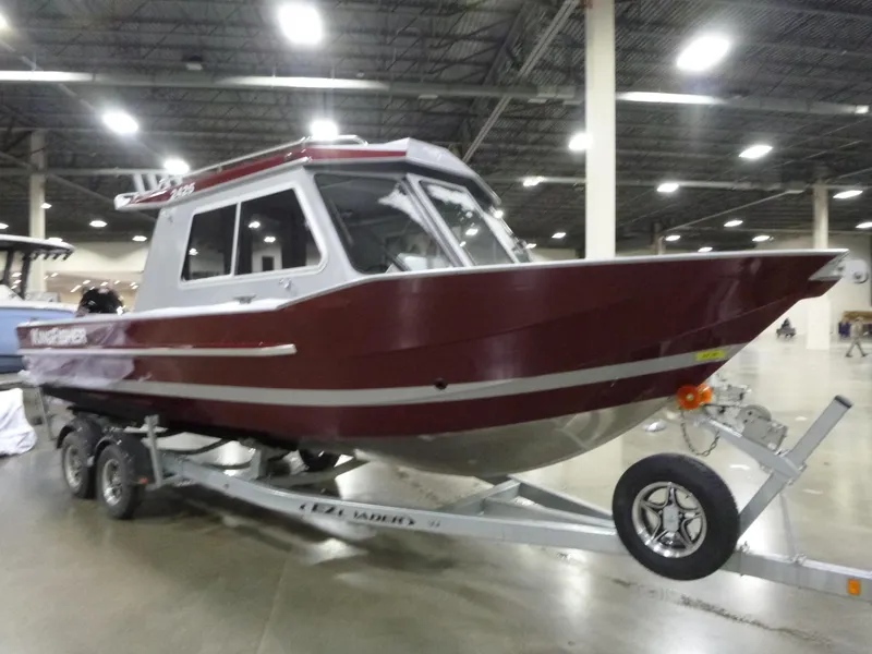 Slide: The Image of 2025 KingFisher 2425 Escape HT boat on trailer in indoor showroom. - 5