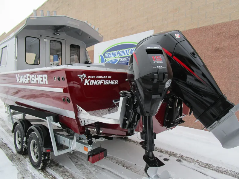 Slide: The Image of 2025 KingFisher 2425 Escape HT boat with outboard motor on snowy trailer. - 51