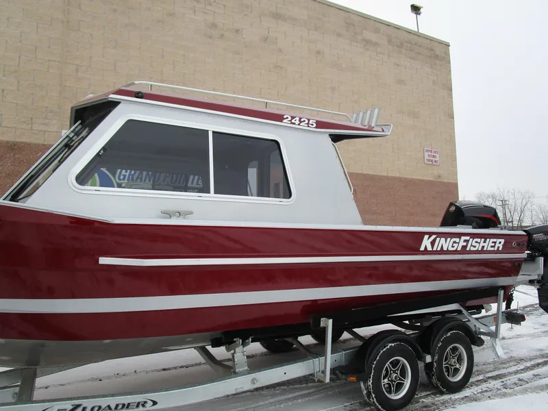 Slide: The Image of 2025 KingFisher 2425 Escape HT boat on trailer, red and white design. - 52