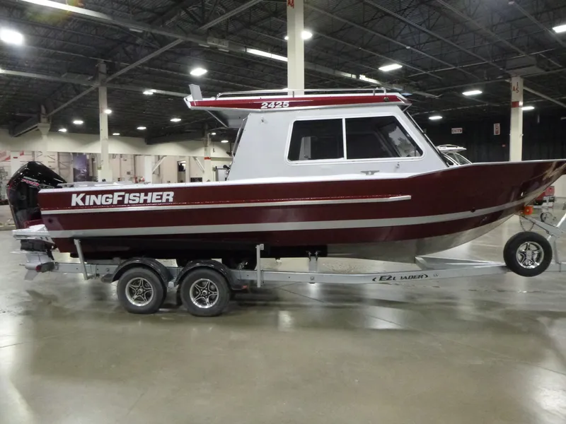 Slide: The Image of 2025 KingFisher 2425 Escape HT boat on trailer in indoor showroom. - 6