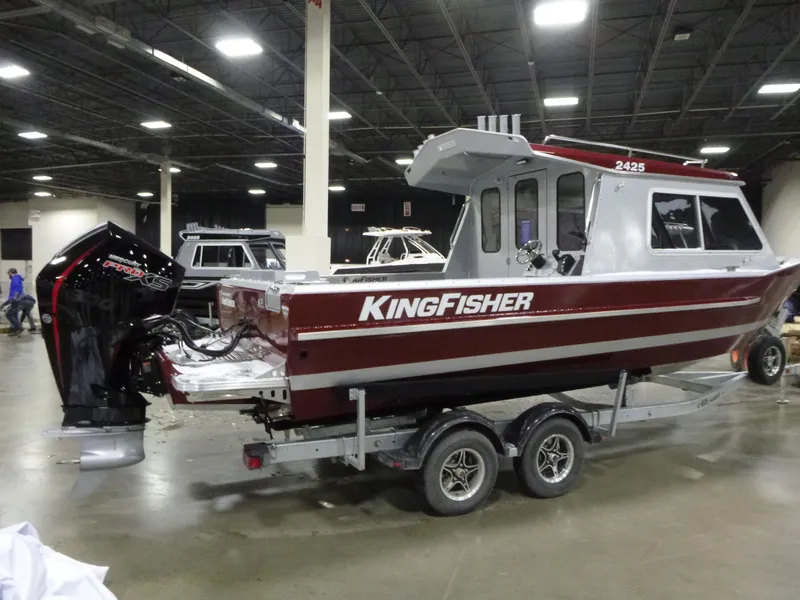 Slide: The Image of 2025 KingFisher 2425 Escape HT boat on trailer in indoor showroom. - 7