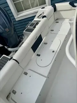 Slide: The Image of 2025 Tidewater 210 LXF boat interior with seating and storage compartments. - 7