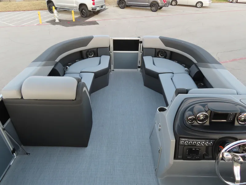 Slide: The Image of 2024 South Bay 224 RS 2.75 boat interior with sleek seating in a parking lot. - 5