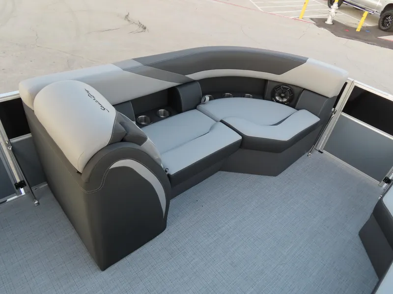 Slide: The Image of 2024 South Bay 224 RS 2.75 pontoon boat interior with gray seating and steering wheel. - 7