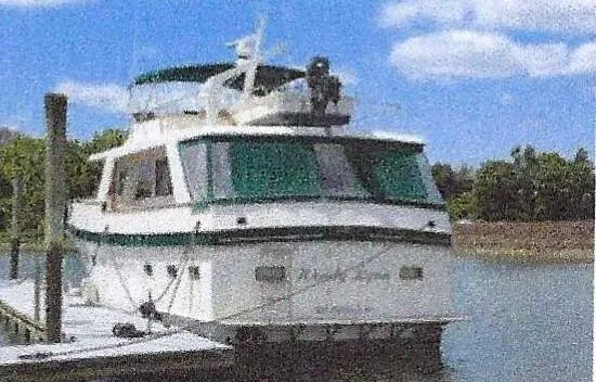 Slide: The Image of 1984 Ocean Alexander Flying Bridge Motor Yacht docked on a sunny day. - 2