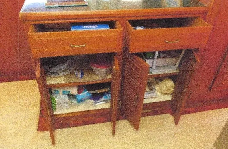 Slide: The Image of Open wooden cabinet with drawers and shelves on 1984 Ocean Alexander yacht. - 22