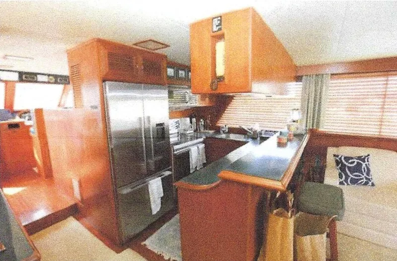 Slide: The Image of Interior of 1984 Ocean Alexander Flying Bridge Motor Yacht with kitchen and seating area. - 23