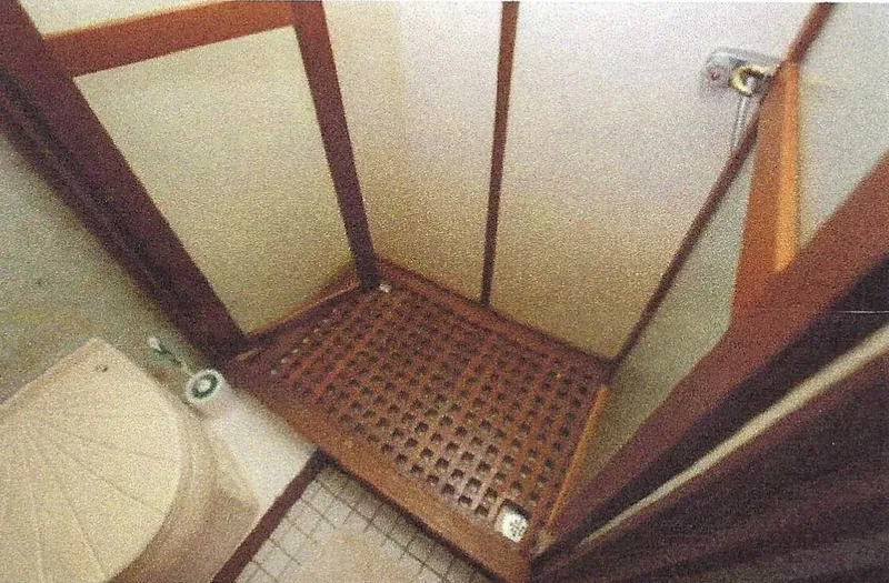 Slide: The Image of 1984 Ocean Alexander Flying Bridge Motor Yacht bathroom with wooden shower floor and toilet. - 32