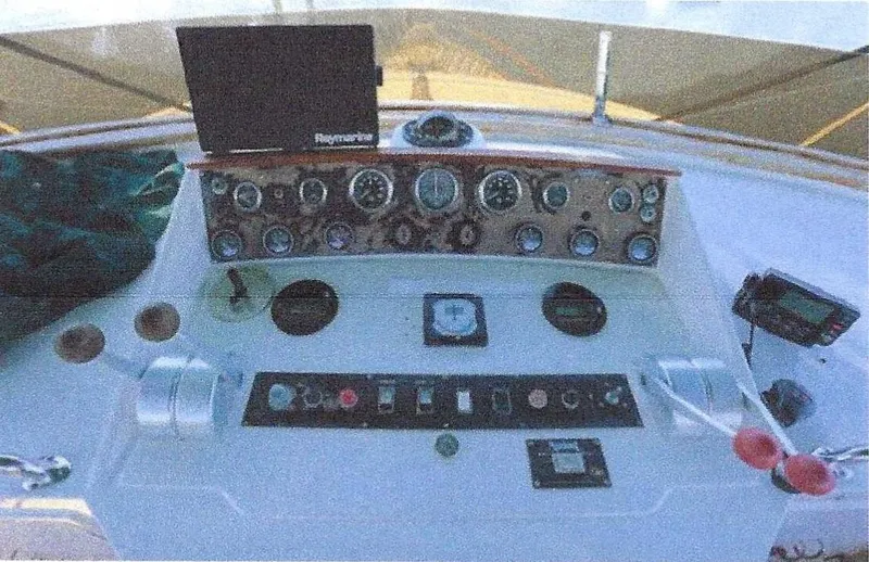 Slide: The Image of 1984 Ocean Alexander Flying Bridge Motor Yacht control panel with gauges and navigation equipment. - 48