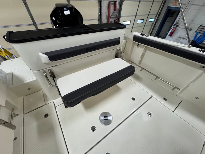 Slide: The Image of 2025 Trophy 25 Pilothouse interior with foldable seating and storage compartments. - 5