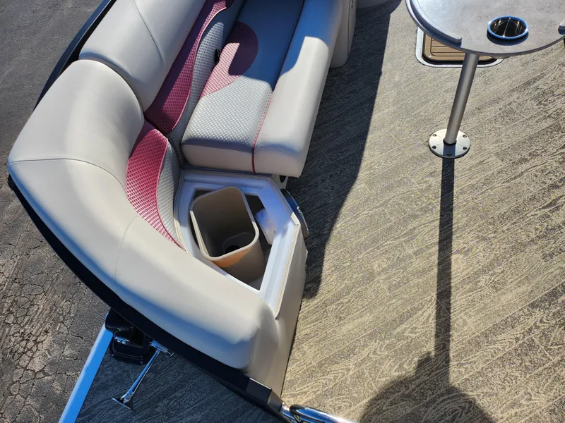 Slide: The Image of 2022 JC Neptoon 25 TT DSL boat interior with cushioned seating and table. - 10