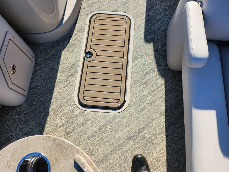 Slide: The Image of Interior of 2022 JC Neptoon 25 TT DSL boat showing floor hatch and seating. - 11