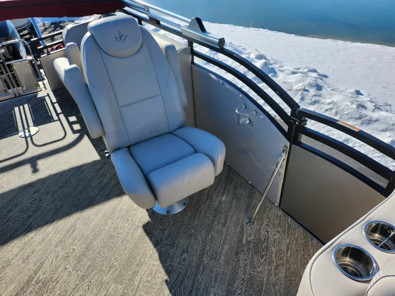 Slide: The Image of 2022 JC Neptoon 25 TT DSL boat interior with plush seating and cup holders. - 13