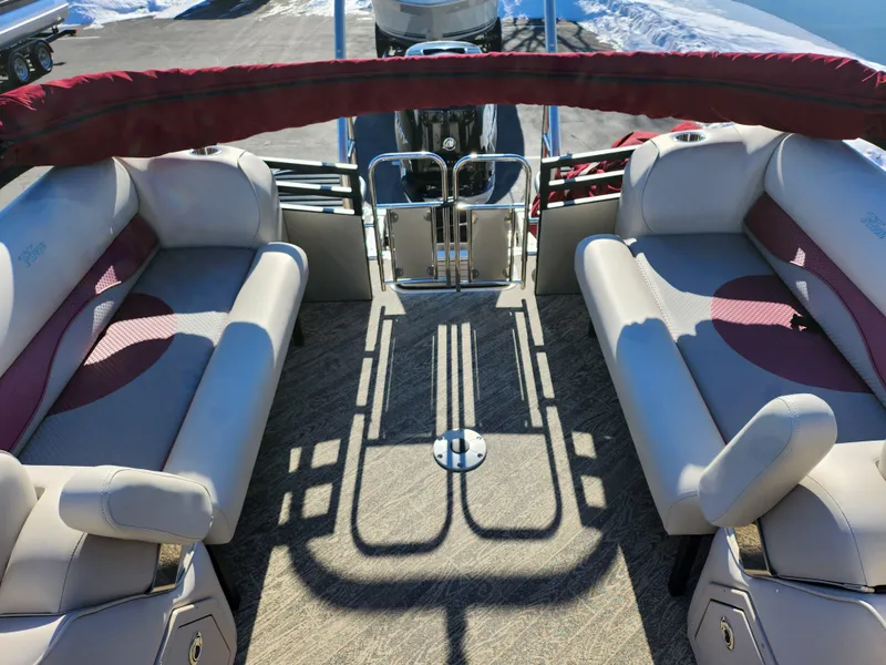 Slide: The Image of 2022 JC Neptoon 25 TT DSL pontoon boat interior with beige and maroon seating. - 15