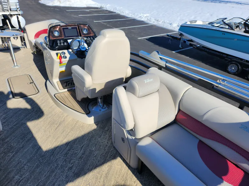 Slide: The Image of 2022 JC Neptoon 25 TT DSL pontoon boat interior with helm and seating. - 17