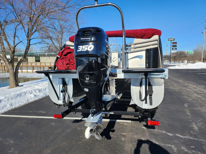 Slide: The Image of 2022 JC Neptoon 25 TT DSL boat with 350 horsepower engine, parked on snowy pavement. - 2