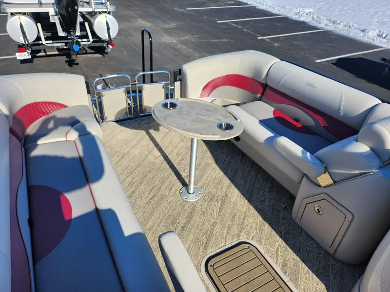 Slide: The Image of 2022 JC Neptoon 25 TT DSL pontoon boat interior with seating and table. - 23