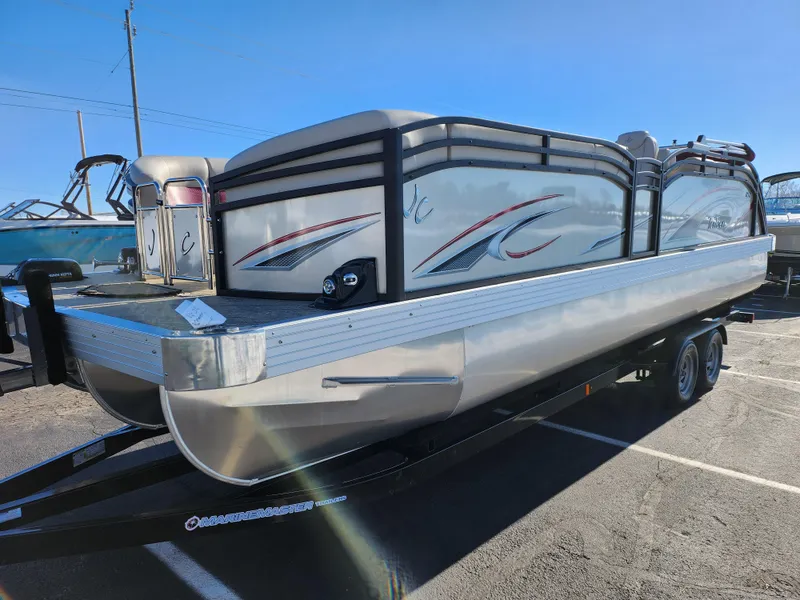 Slide: The Image of 2022 JC Neptoon 25 TT DSL pontoon boat on trailer in parking lot. - 5