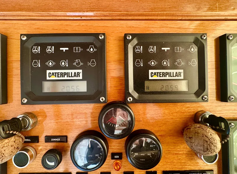 Slide: The Image of Control panel of a 2001 Grand Banks 49 Eastbay HX with Caterpillar displays. - 13