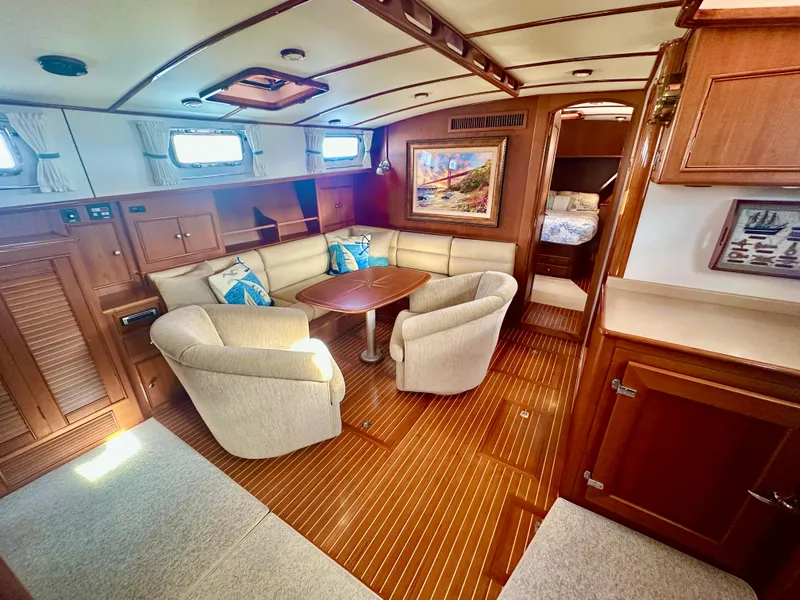Slide: The Image of Luxurious interior of 2001 Grand Banks 49 Eastbay HX yacht with elegant seating and wood finishes. - 16