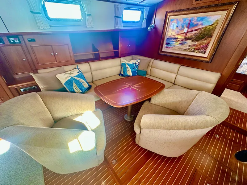 Slide: The Image of Luxurious interior of 2001 Grand Banks 49 Eastbay HX yacht with plush seating and elegant decor. - 17