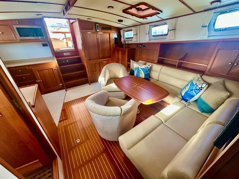 Slide: The Image of Luxurious interior of 2001 Grand Banks 49 Eastbay HX yacht with elegant seating and wood finishes. - 18